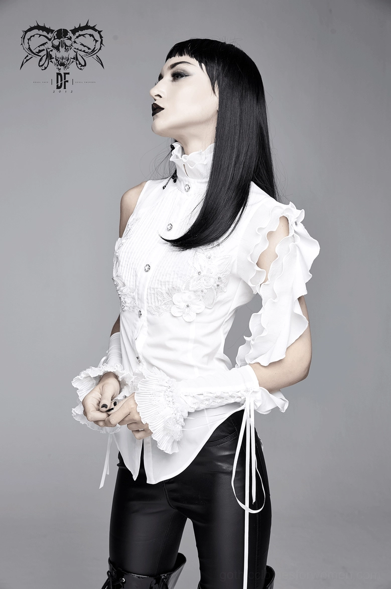 Back full-length view of white gothic blouse on model displaying tailed hemline and ruffled edge details