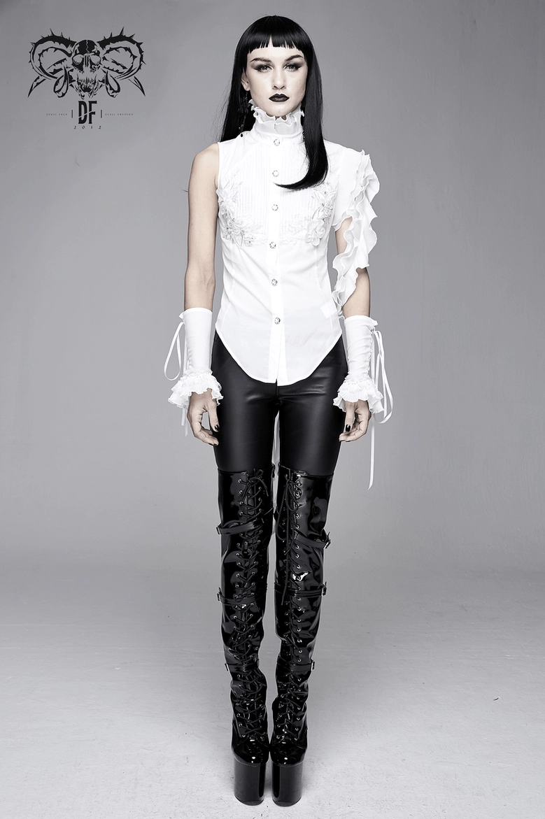 Side view of white gothic blouse displaying slim fit, floral appliqué details, and ruffled sleeve attachment points
