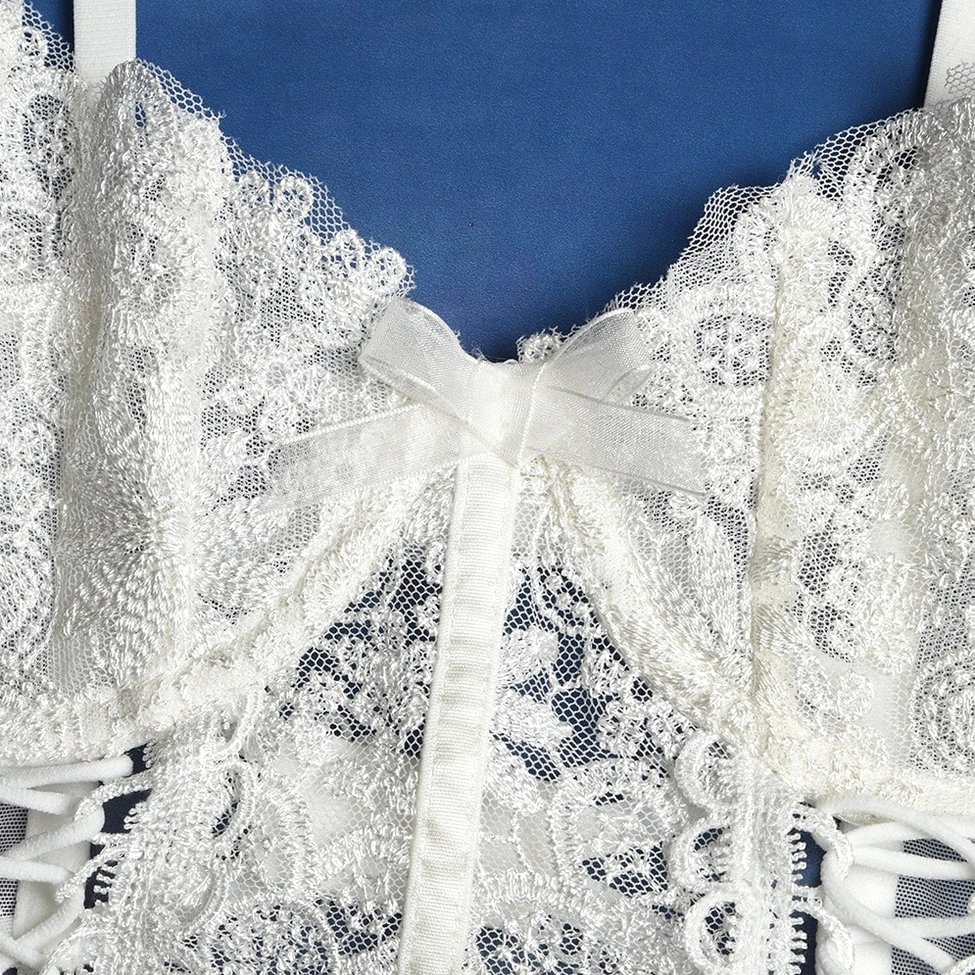 White gothic lingerie set front display showing full lace coverage and bow accent details