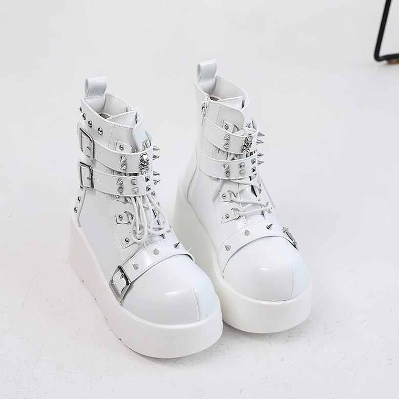 White gothic platform ankle boots pair front view showing multiple straps and rivets