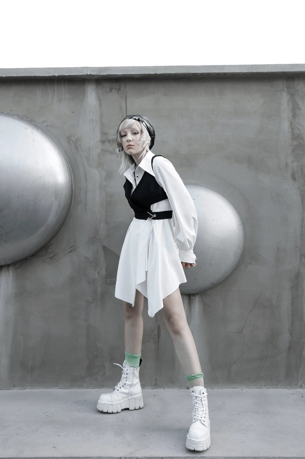 White gothic asymmetrical swallowtail dress product presentation, emphasizing architectural design and premium fabric construction