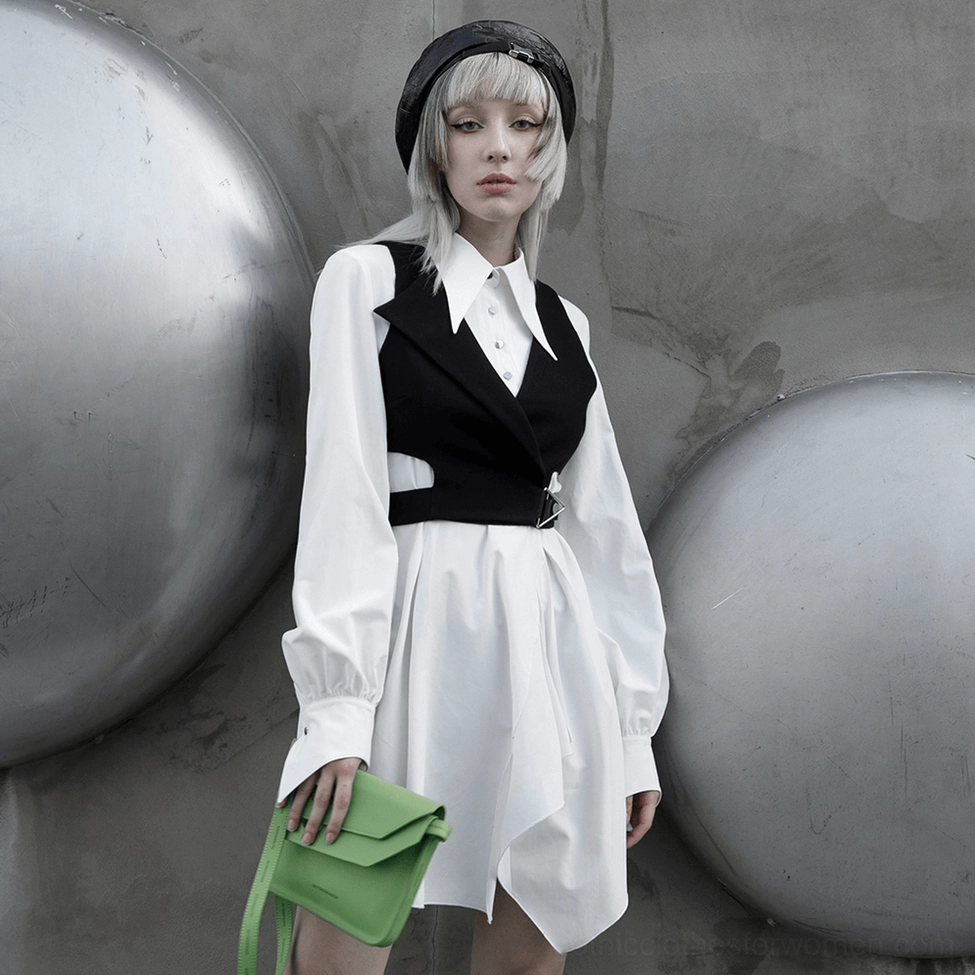 White gothic dress asymmetrical swallowtail hemline detail, showcasing flowing wave structure and artistic hem construction
