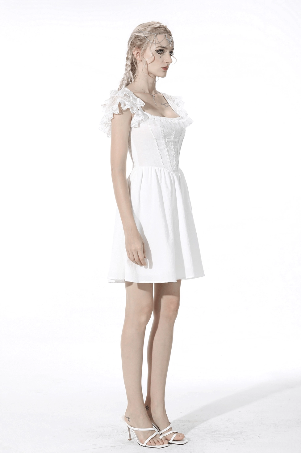 White gothic lolita cross-chest mini dress - complete product showcase with corset bodice, pearl beading, lace details, A-line silhouette