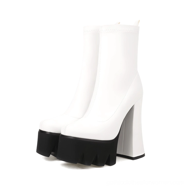 White genuine leather gothic platform boots pair shown from side angle with black serrated platform sole