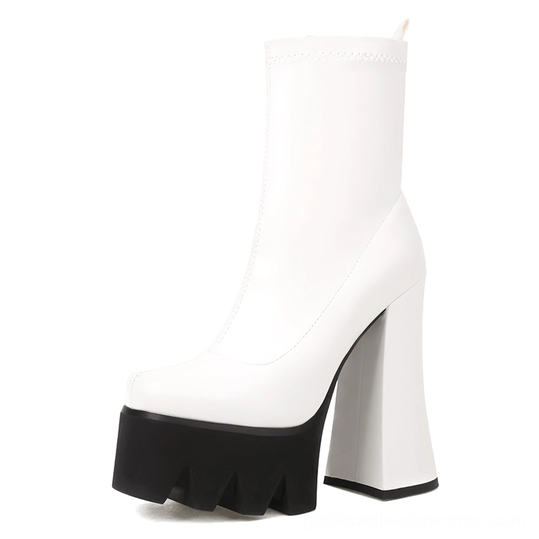 White genuine leather gothic platform boots with chunky square heel and serrated sole, front three-quarter view