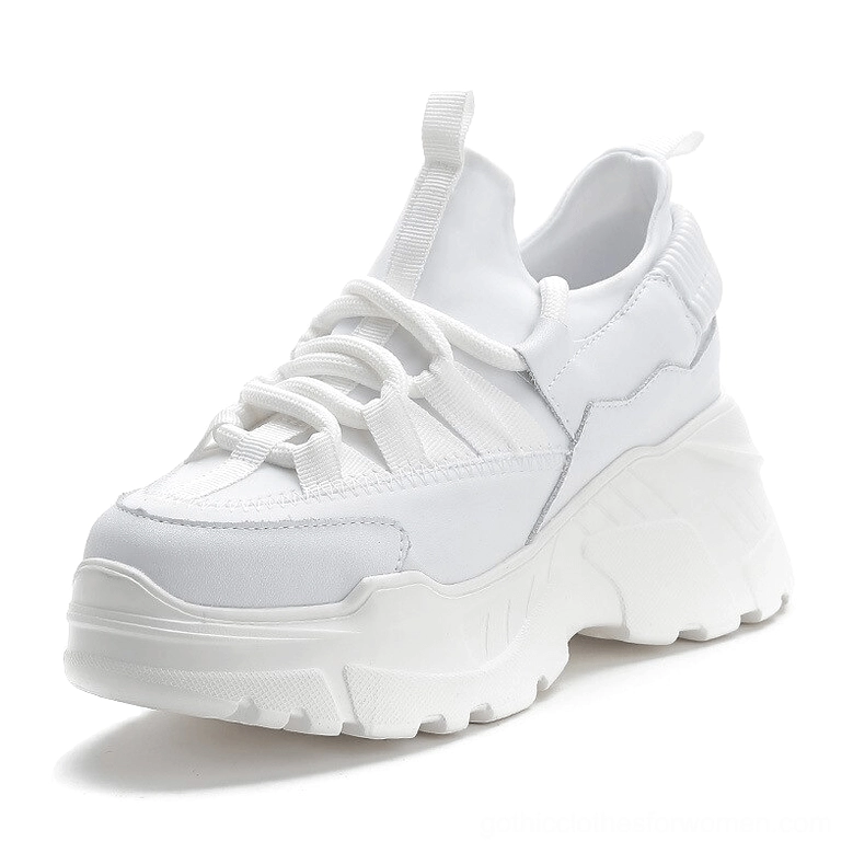 White women's platform leather sneakers with thick chunky sole and lace-up design, front three-quarter view