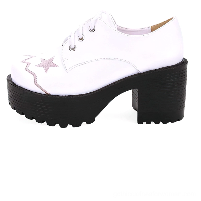 White lace-up platform oxford shoe side three-quarter view with embroidered star and zigzag patterns