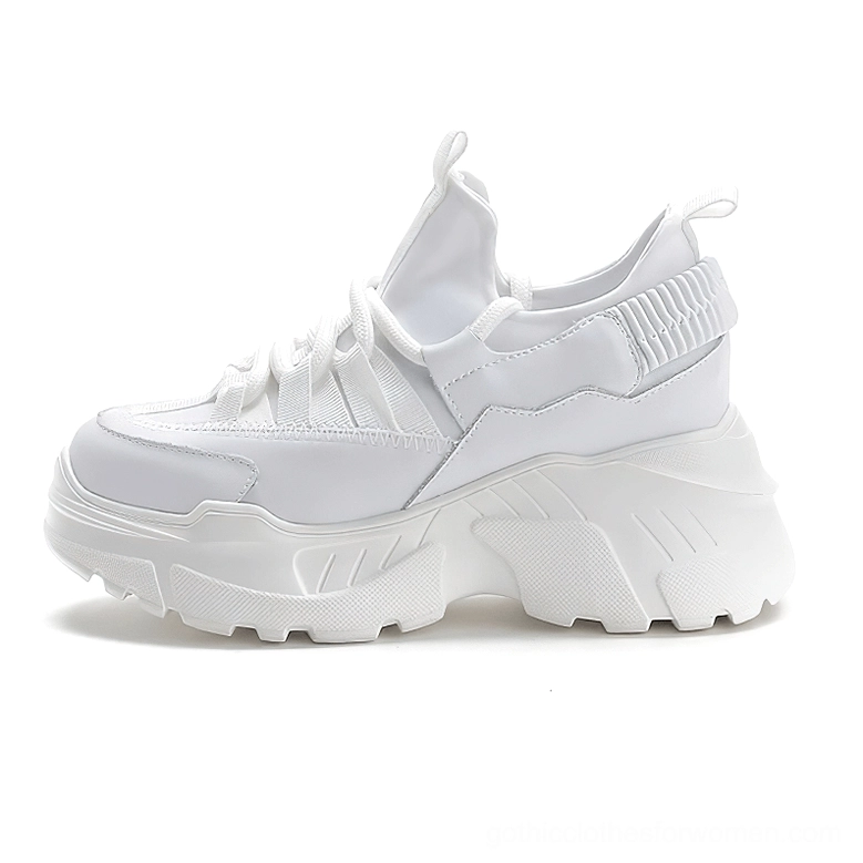 Single white women's platform sneaker side profile showing smooth fabric upper and thick lug sole design
