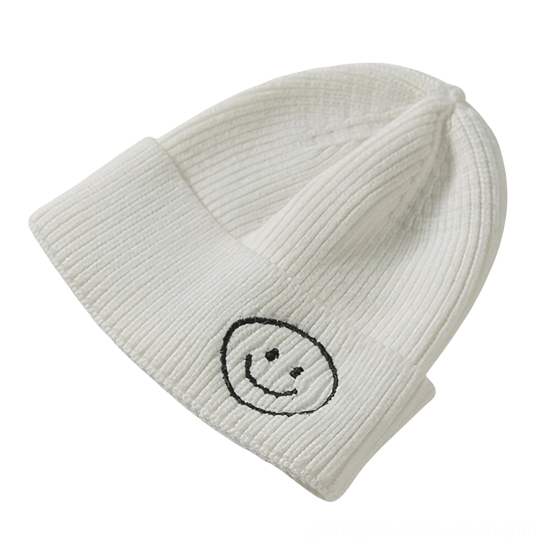 White smiley face embroidered knit beanie with dark smiley logo, minimalist gothic winter hat
