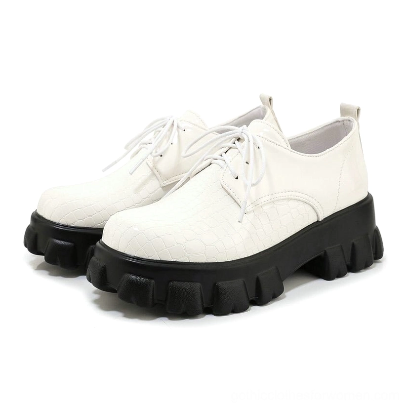 White snake-texture patent leather lace-up platform pump, front view showcasing round toe and reptilian grain pattern