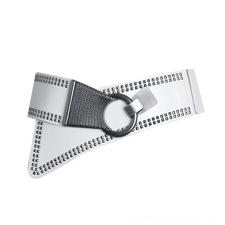 White studded women's waist belt with black accent details and round metal ring buckle, angled flat lay view