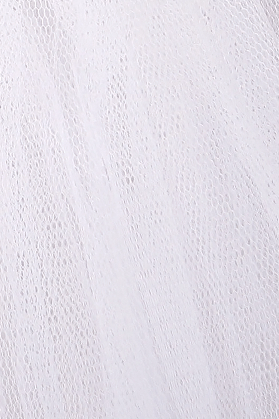 Close-up texture detail of honeycomb mesh tulle fabric - white layered sheer material
