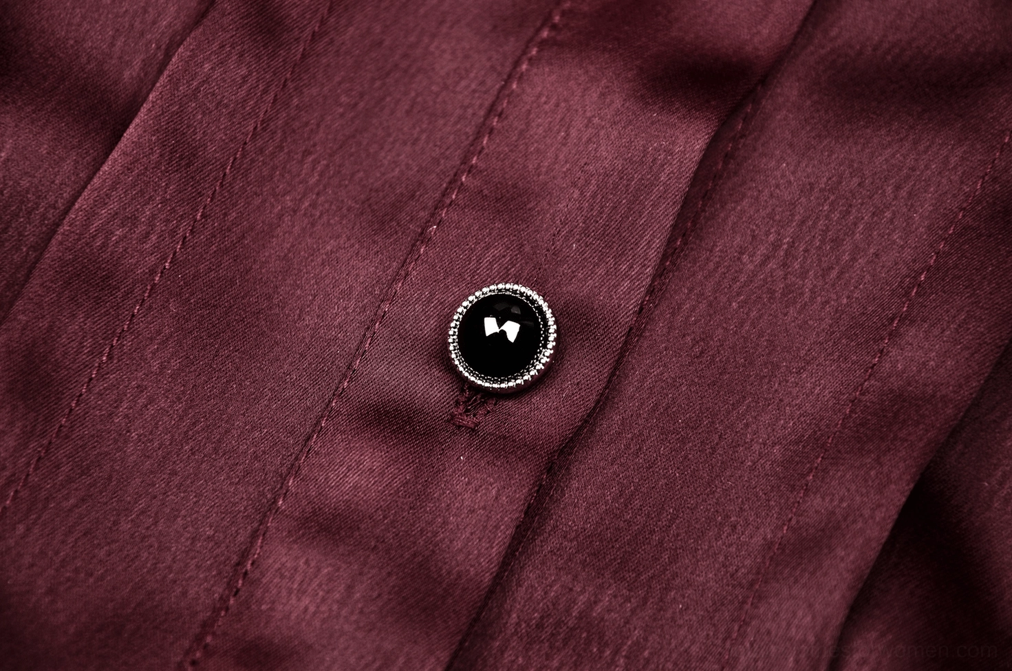 Wine red puff sleeve blouse texture and fabric detail showing polyester satin-like sheen