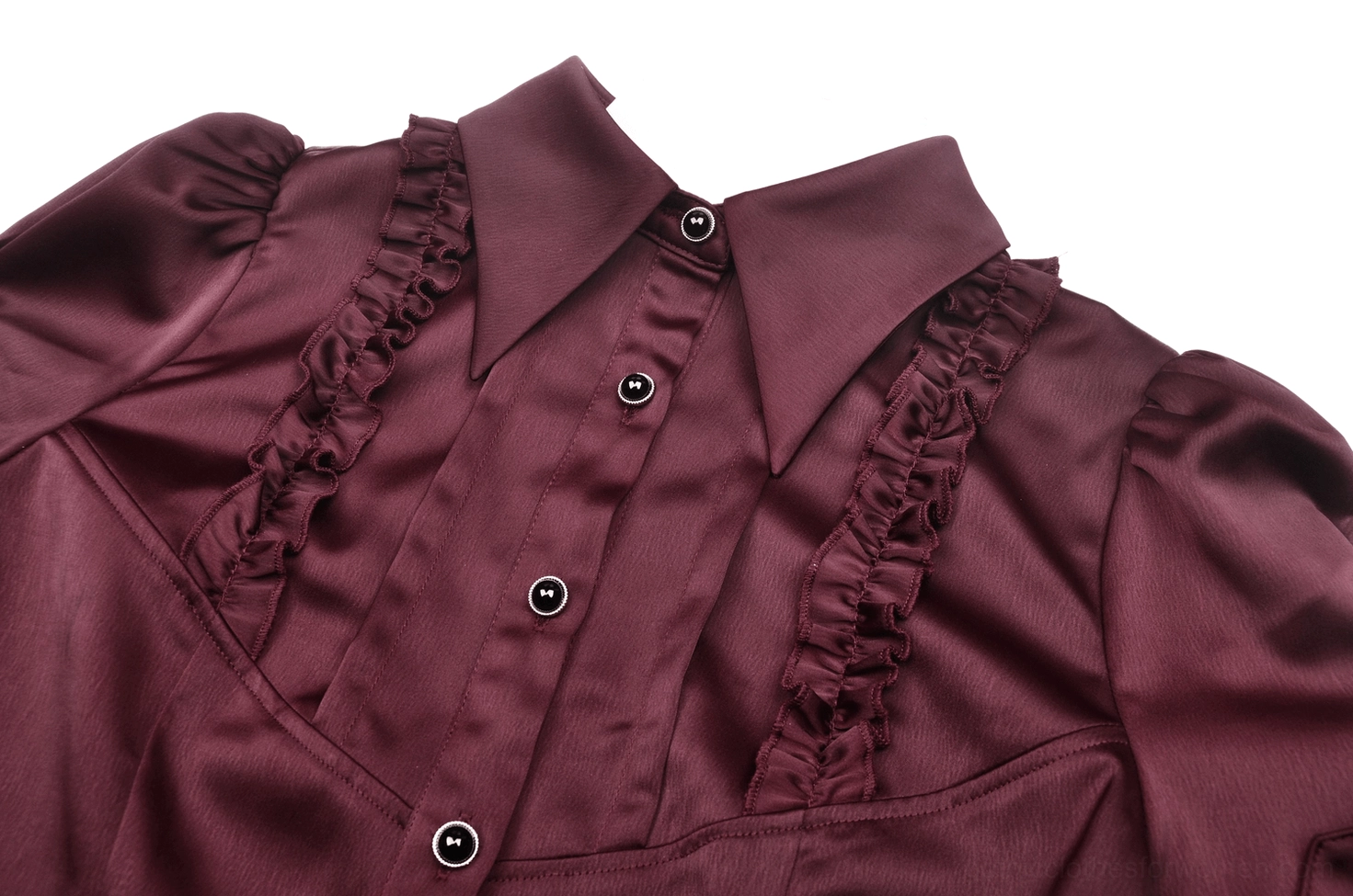 Close-up detail of wine red gothic blouse ruffled trim and round black button closures