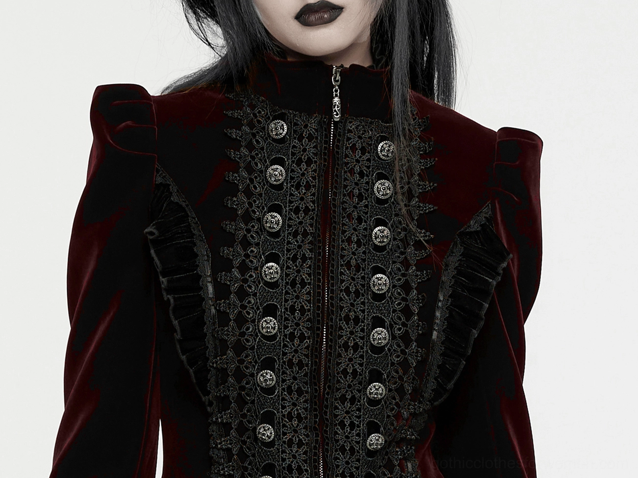 Burgundy gothic coat fabric and construction detail showcasing velvet texture and ornamental elements