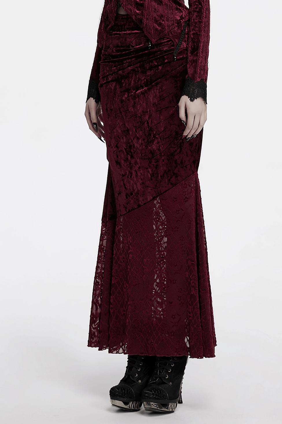 Burgundy velvet fishtail skirt on model displaying back silhouette with lace hem and overall garment drape