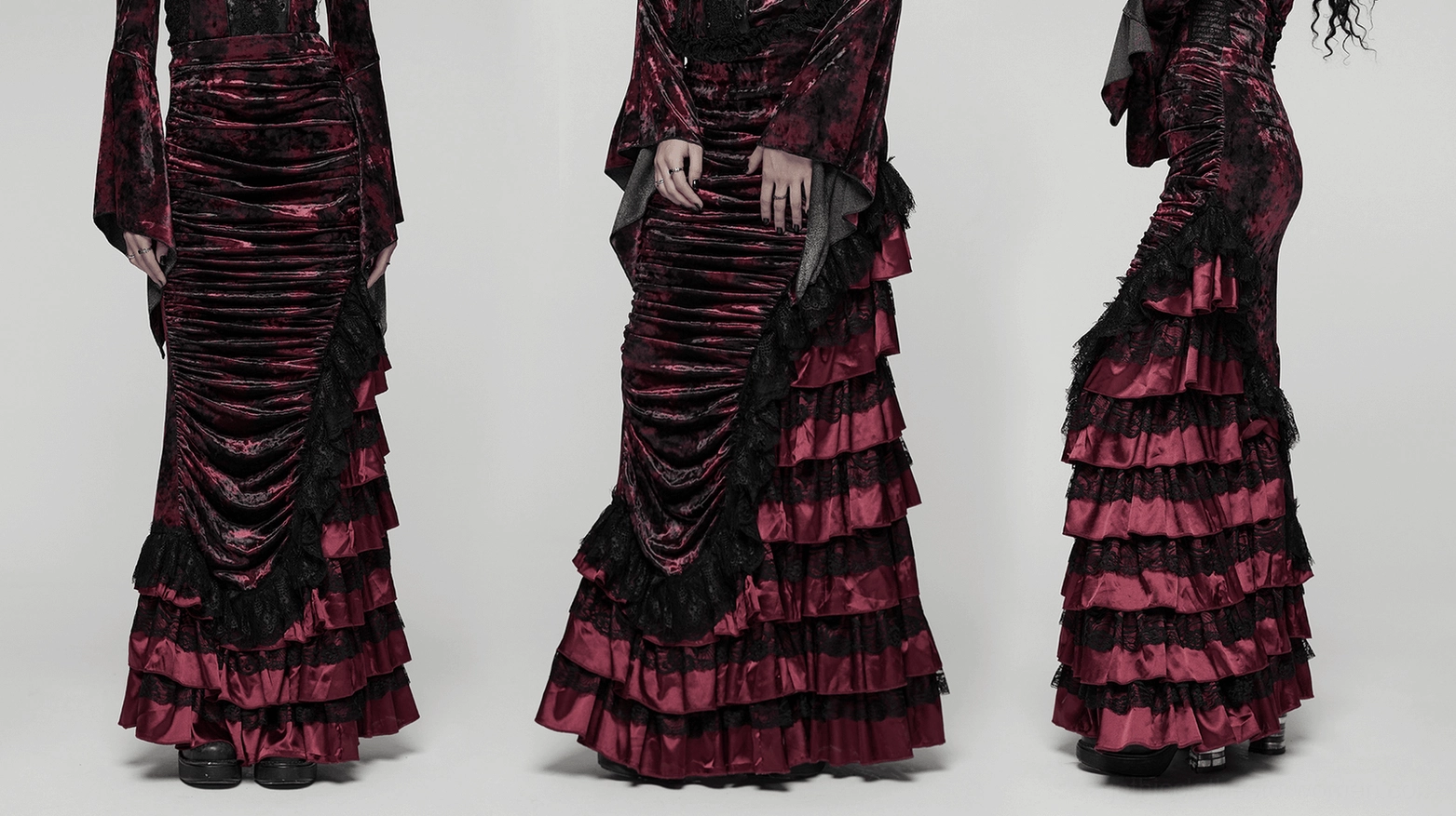 Wine red velvet gothic fishtail skirt dramatic movement shot showing tiered lace hem flow and ruched construction