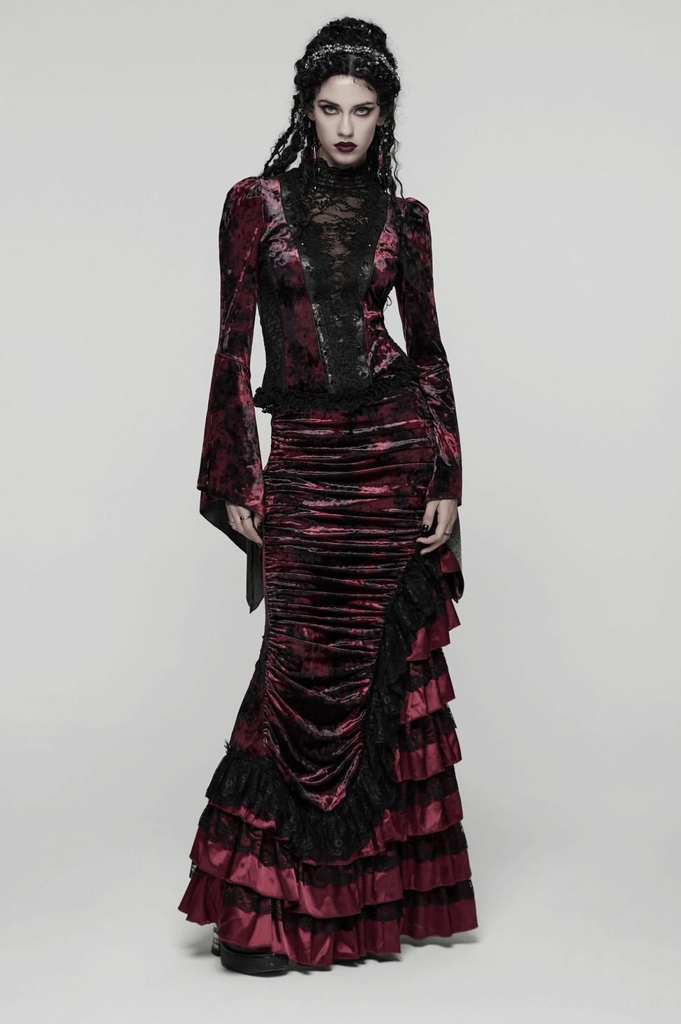 Alternative fashion model wearing wine red velvet gothic skirt paired with band tee for casual goth styling