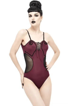 Wine red gothic one-piece swimsuit front three-quarter view showing lace-up bust detail and mesh side cutouts on model