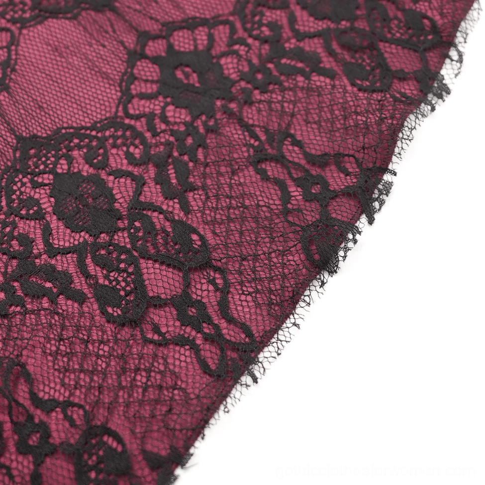 Wine red gothic lace skirt showing intricate layered lace construction, tassel accents, and buckle waist details in studio lighting