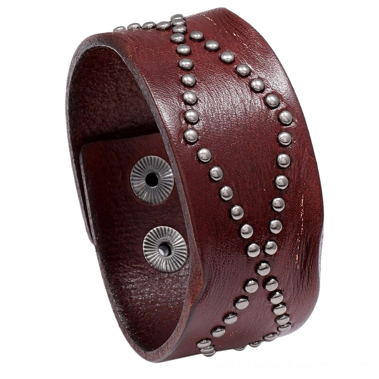 Wine red leather gothic cuff bracelet featuring geometric rivet detailing and secure snap fastener, studio shot on white background