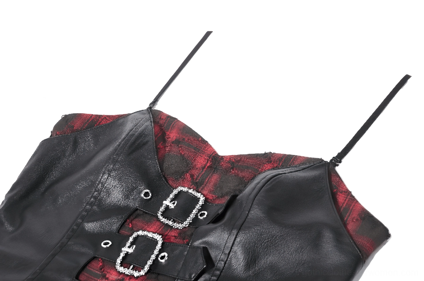 Macro detail shot of triple silver rhinestone buckles on red and black tartan corset dress strap showing luxury hardware decoration