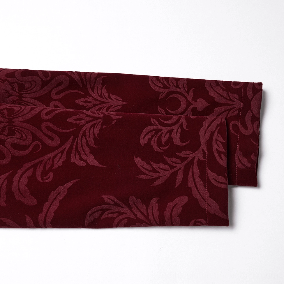 Wine red velvet gothic tailcoat jacket detail showcasing damask embossing and fabric texture
