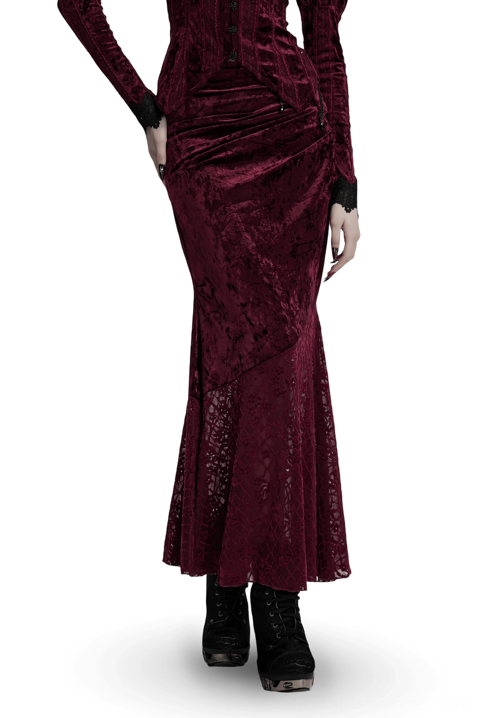 Wine red gothic velvet fishtail skirt worn by model showing asymmetrical waistband and lace hem, front three-quarter view on white background