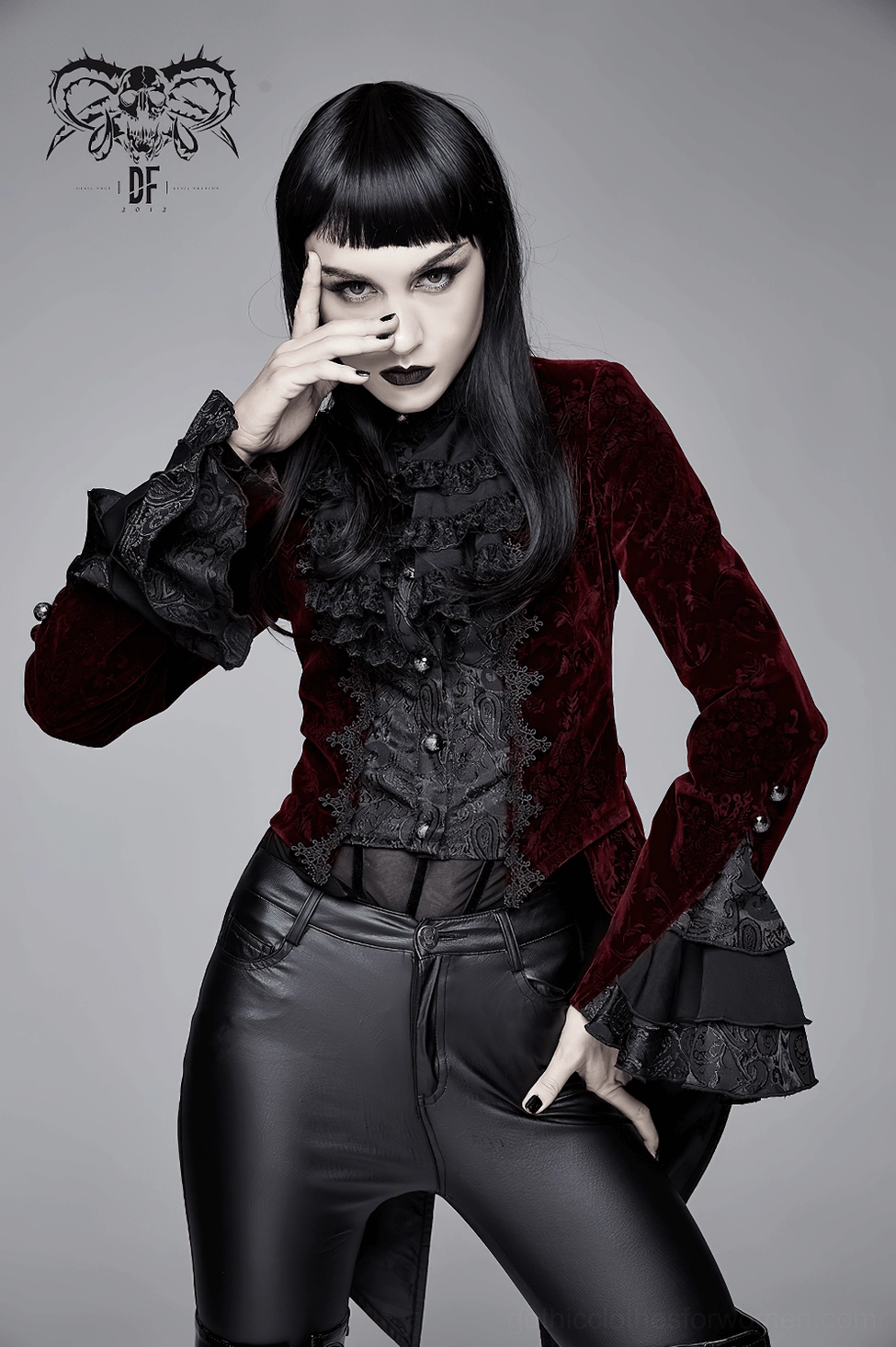 Detailed view of layered flared lace cuffs on wine red gothic velvet tailcoat showing precision engineering