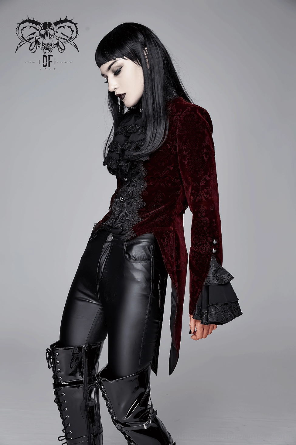 Texture and fabric closeup of wine red premium velvet material used in gothic tailcoat jacket