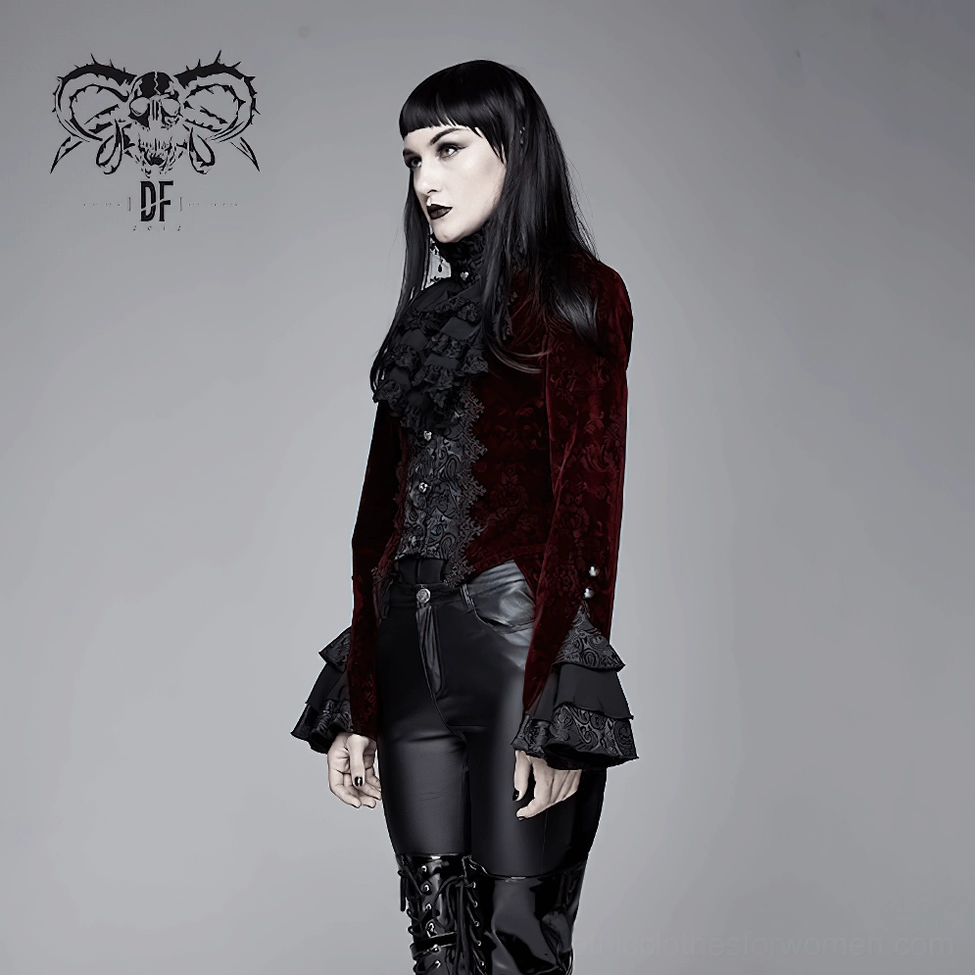 Full front view of wine red gothic velvet tailcoat on model paired with black leather pants and platform boots