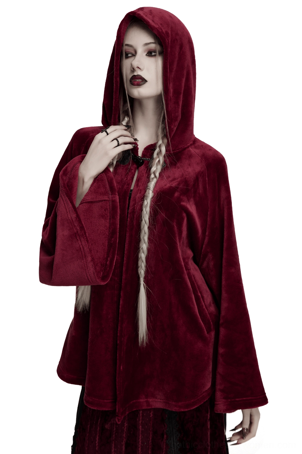 Wine red velvet hooded moon cape worn by goth woman with long braid, front view showcasing heart-shaped toggle closures and loose silhouette