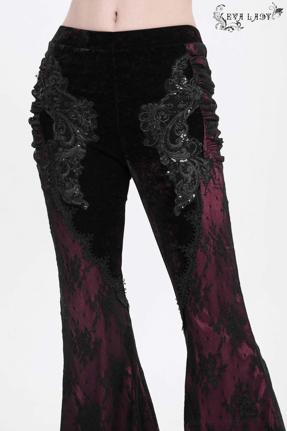 Witchy dark aesthetic black-burgundy velvet flare pants with intricate lace appliqué and theatrical flared silhouette