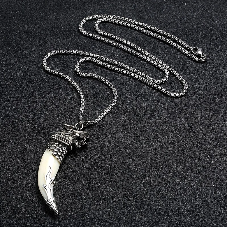 Wolf head tooth pendant close-up side view - roaring wolf face carving detail with antique silver patina