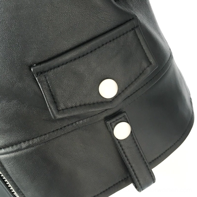 Women's black genuine leather motorcycle jacket side seam and sleeve detail, highlighting tailored fit and zipper cuff construction