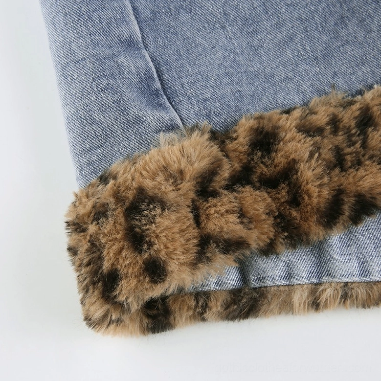 Women's denim mini skirt with leopard faux-fur accents, detail construction view