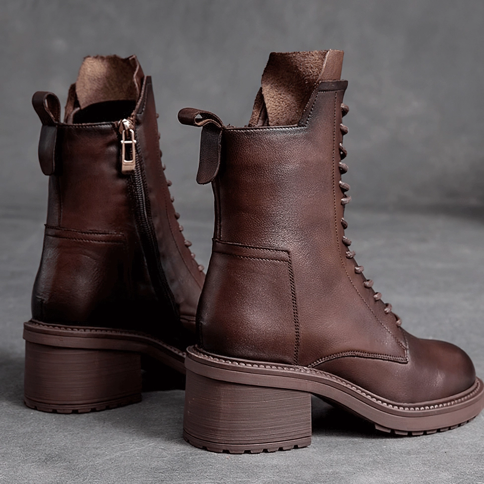 Women's gothic leather ankle boots showing genuine cow leather texture and patina development