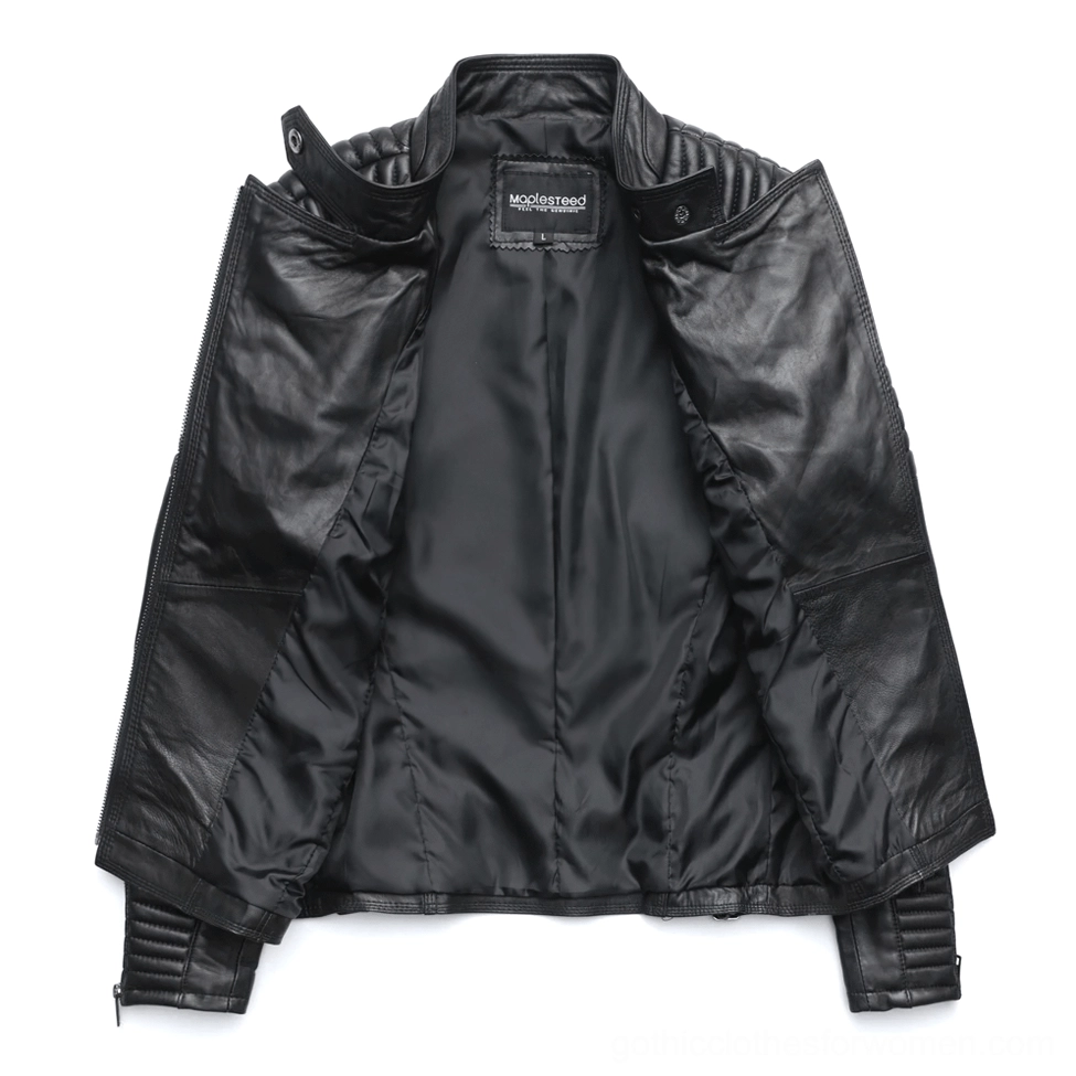 Interior view of women's black leather gothic jacket showing satin lining and quality craftsmanship