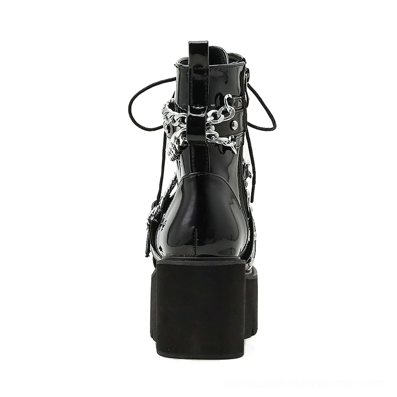 Women's gothic platform ankle boots with metal chain and rivet accents, showcasing alternative fashion statement piece