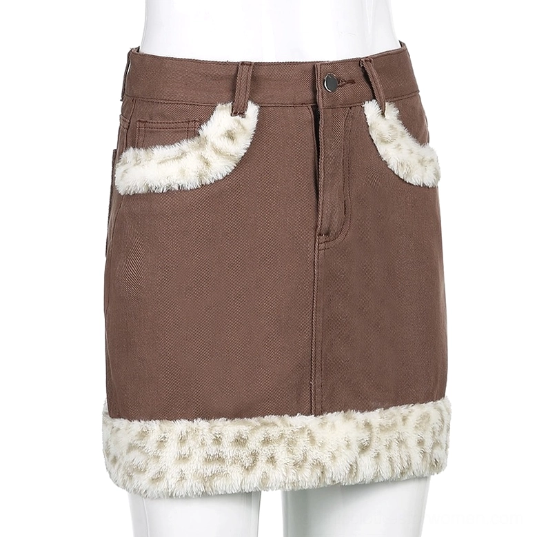 Women's high-waist denim skirt alternative fashion styling with fuzzy leopard accents