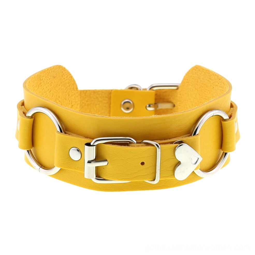 Yellow leather choker with silver buckles and heart-shaped accent, vibrant gothic alternative