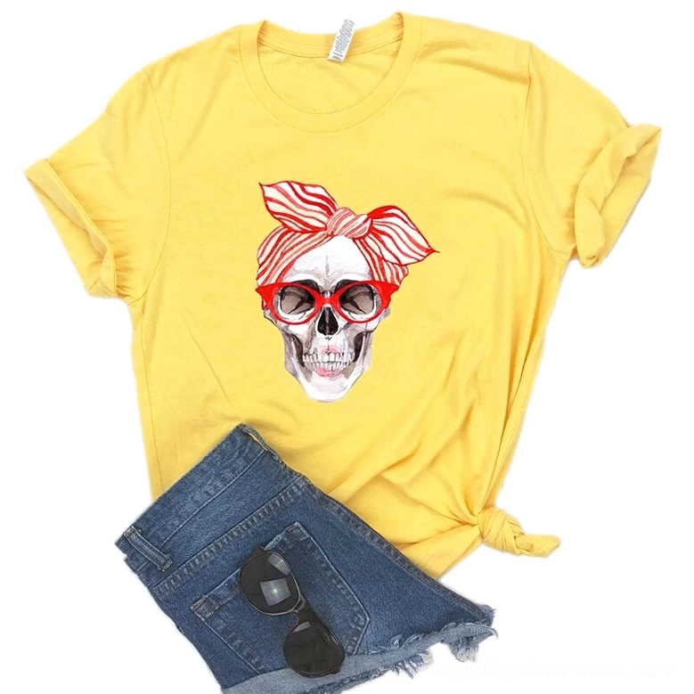 Yellow skull print t-shirt styled with denim shorts and sunglasses, casual gothic look
