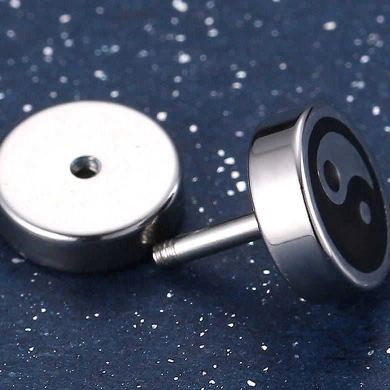 Black and white yin yang stud earring screw-back post detail close-up polished